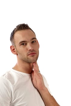 Pensive young man in front of white background