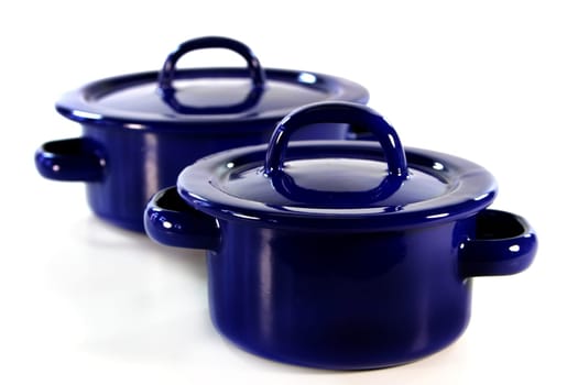 a blue cooking pot against a white background