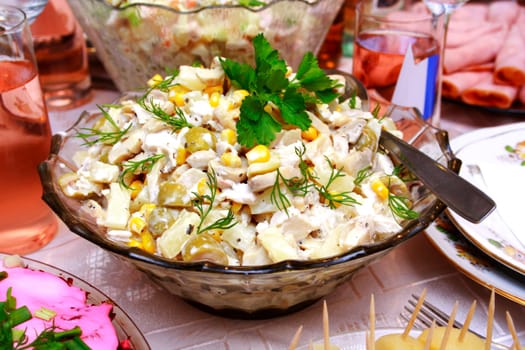 Bowl with a salad made from corn, chicken, apple