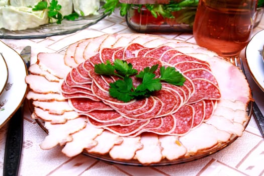salami slices on the table with pork