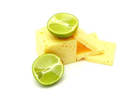 Slices cheese with laime on white background