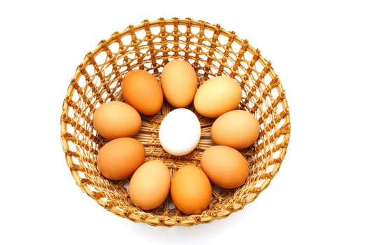 Eggs in the basket isolated on white