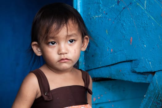 Adorable young girl living in poverty. Manila, Philippines.