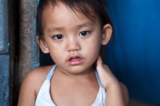 Adorable young girl living in poverty. Manila, Philippines.