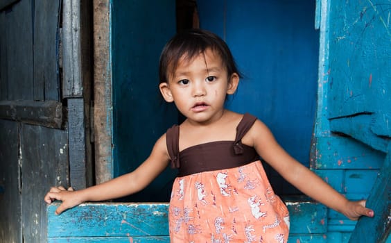 Adorable young girl living in poverty. Manila, Philippines.