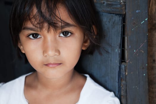 Portrait of an Asian girl against wall in natural light - Manila, Philippines