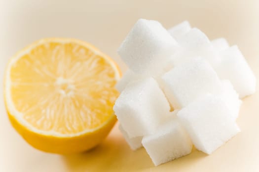 Fresh yellow lemon half with lots of sugar