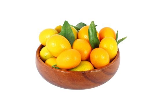 kumquat midget orange in wooden bowl isolated on white
