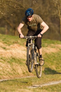 Jumping mountain biker