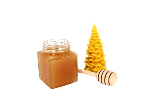 Natural products made of honeybees honey with dipper and wax candle