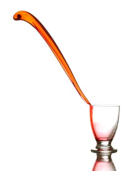 Colored liquid splashing out on a white background