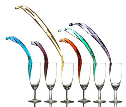 Colored liquid splashing out on a white background