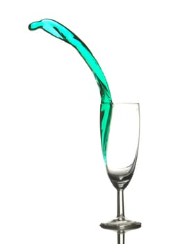 Colored liquid splashing out on a white background