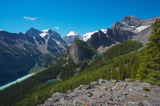 In the Lake Louise area of the Canadian Rockies showing, Lake Louise, Mirror Lake and Lake Agnes with the snow covered summits of Mounts Temple, Lefroy and Victoria in the background