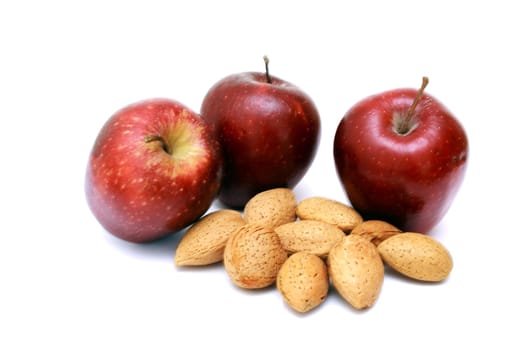 Fresh red apples with nuts isolated on white