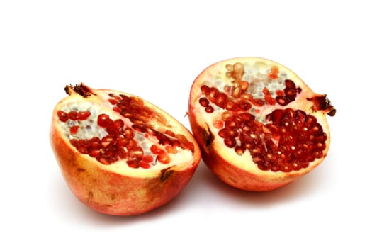 fresh and tasty pomegranate isolated on white