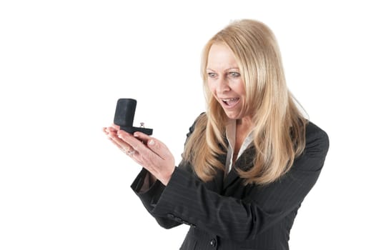 Younger looking woman looking at a ring