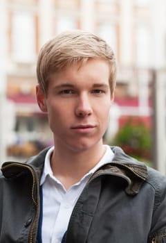 Outdoor portrait of handsome blond young man