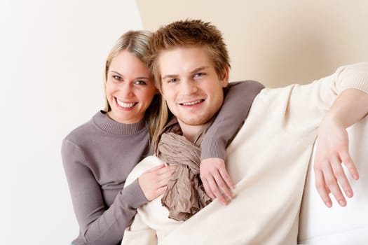 Couple in love - happy relax at home together in living room