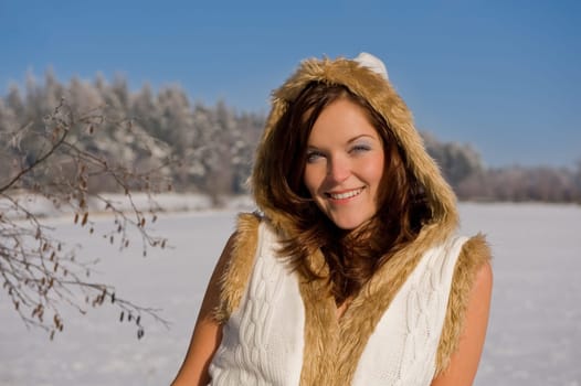 Smiling sexy model in winter nature