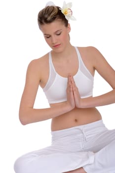 Fitness - Young woman in yoga position on white background relaxing
