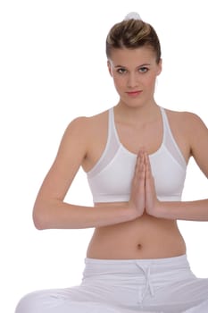 Fitness - Young woman in yoga position on white background relaxing
