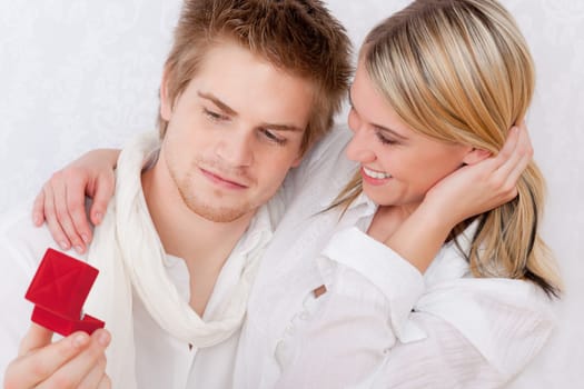 Couple in love - getting engagement ring, romantic