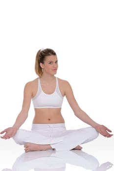 Fitness - Young woman in yoga position on white background relaxing
