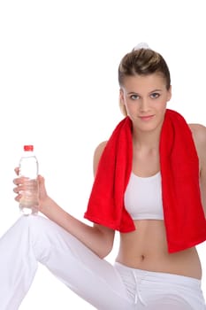 Fitness - Young sportive woman with water and towel on white background