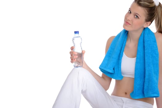 Fitness - Young sportive woman with water and towel on white background