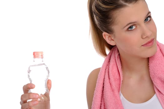 Fitness - Young sportive woman with water and towel on white background