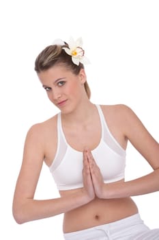 Fitness - Young woman in yoga position on white background relaxing
