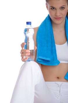 Fitness - Young sportive woman with water and towel on white background