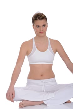 Fitness - Young woman in yoga position on white background relaxing