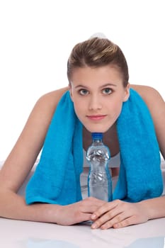 Fitness - Young sportive woman with water and towel on white background