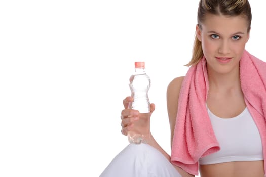 Fitness - Young sportive woman with water and towel on white background