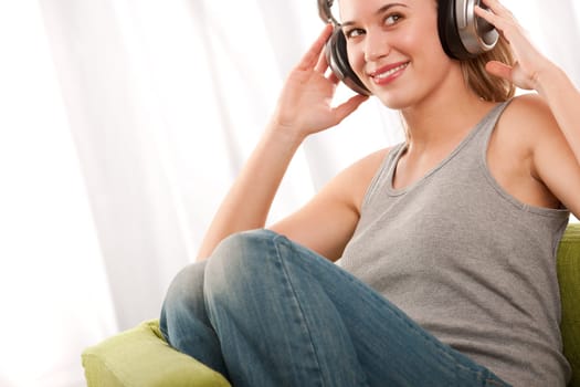 Blond teenage girl listening to music