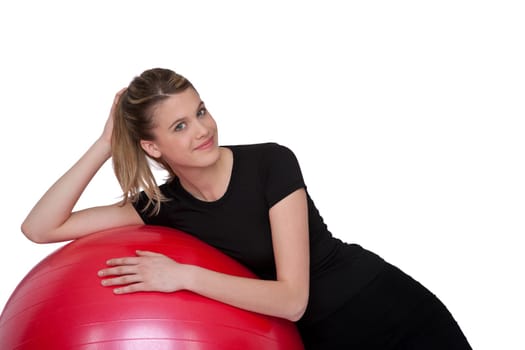 Fitness - Young happy woman with exercise ball on white background