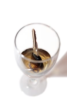 whiskey with keys inside glass on white background depicting drunk driving and addictions can kill