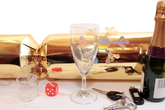 glass dice and keys on white background depicting drunk driving and gambling kills