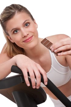 Fitness series - Woman holding piece of chocolate on white background