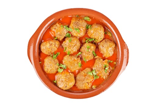 Fresh meatballs in tomato sauce with peas isolated on white background