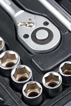 Socket wrench toolbox background. Shallow depth of field