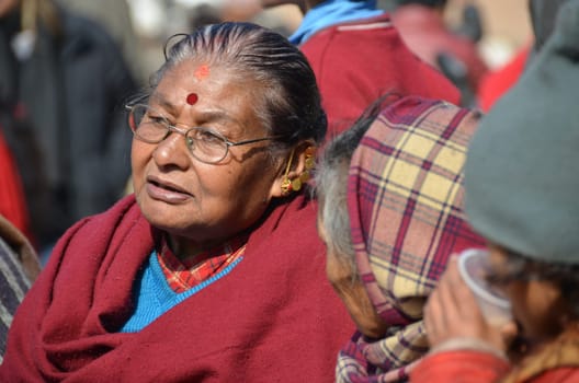 nepalese woman with black hair and red dot