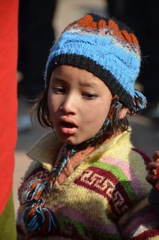 Nepalese child with blue cap in Bhaktapur, Nepal