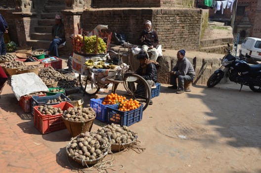 typical Nepal streetscene with some people at a market