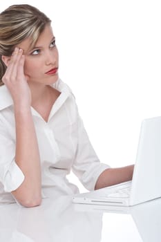 Blond attractive woman working with laptop and thinking on white background