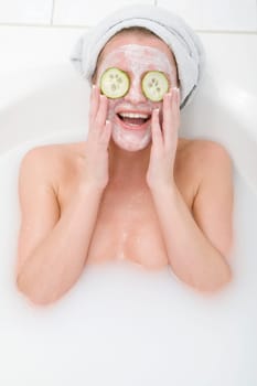 Woman with cucumber mask