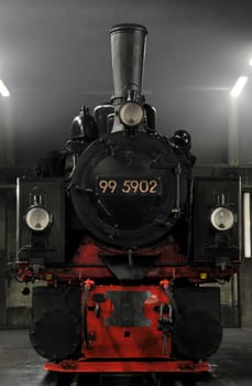 Mallet locomotive on a pit for inspection