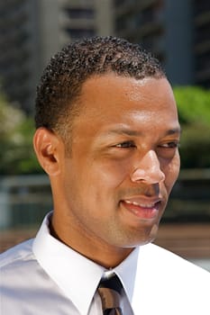 An confident and successful African-American businessman in a power suit